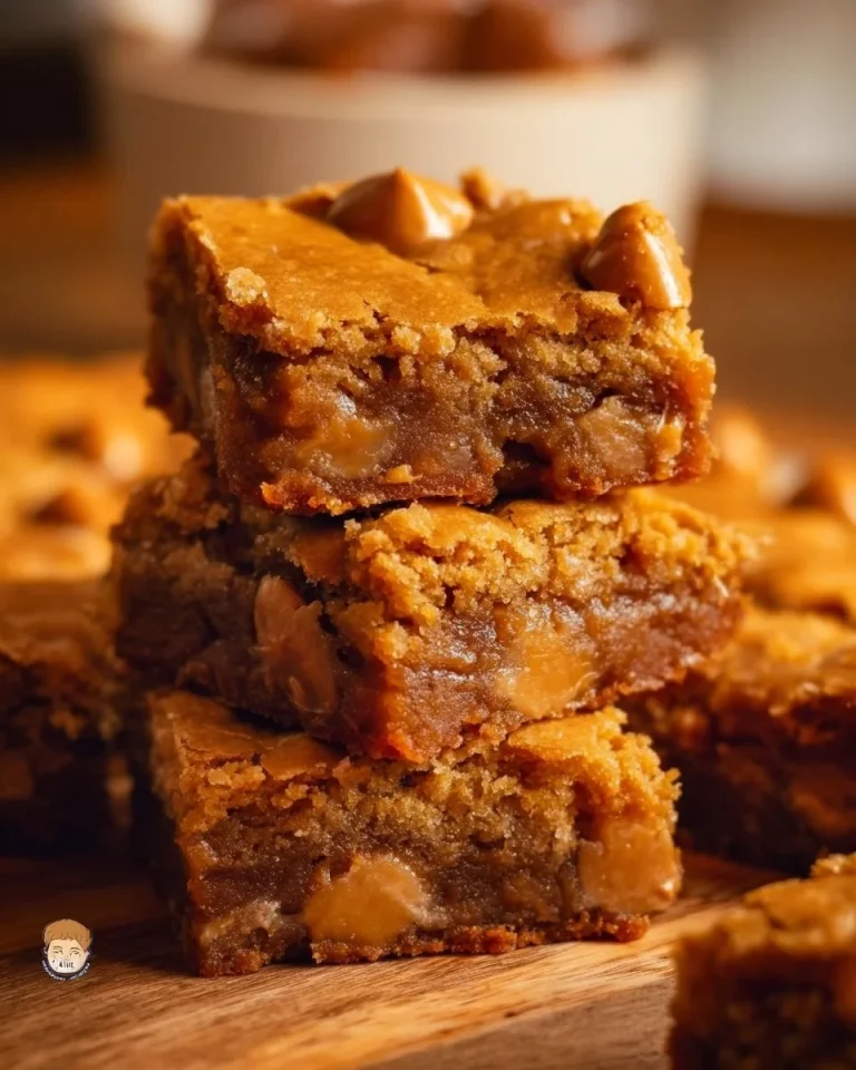 Chewy butterscotch blondies on a plate, fresh out of the oven