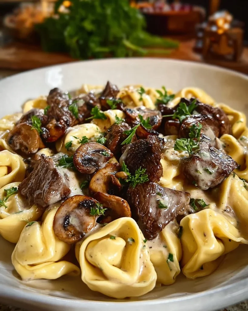 Steak and Mushroom Tortellini Alfredo served in a creamy sauce
