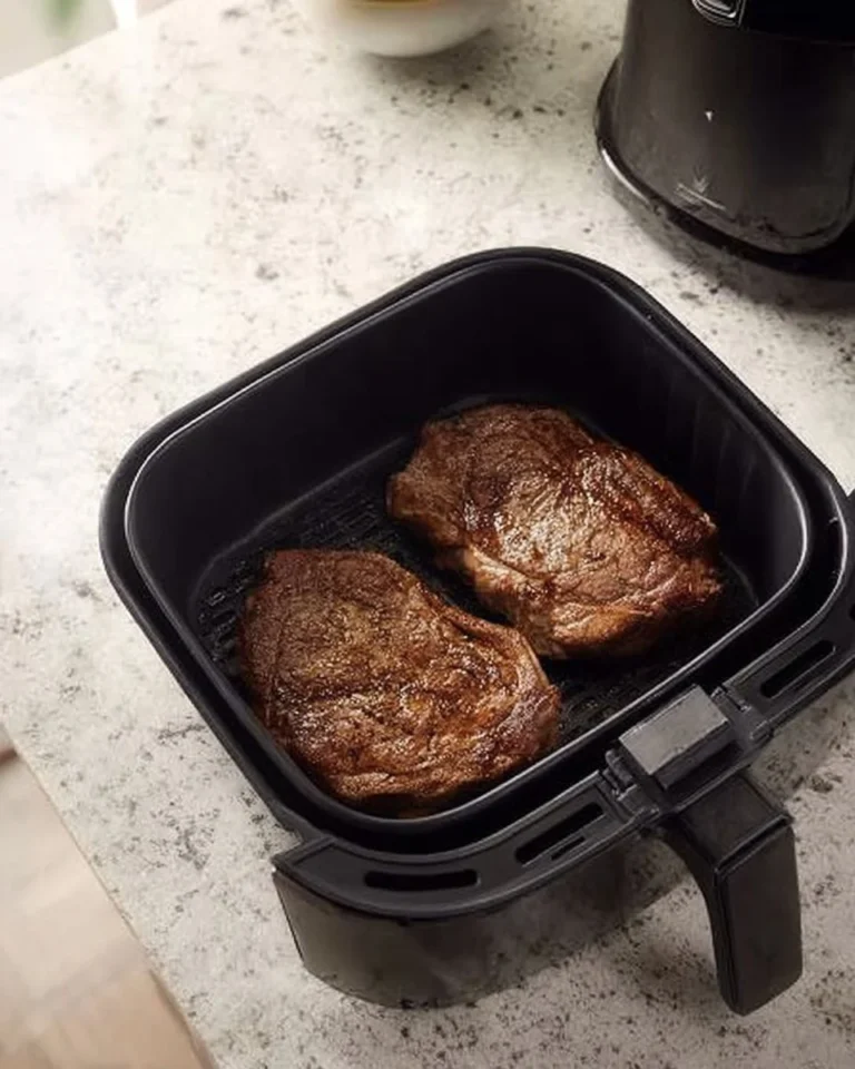 Delicious air fryer ribeye steak drizzled with blue cheese butter.