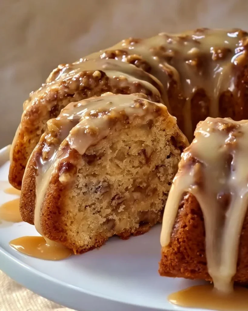 Delicious Apple Pecan Cake topped with rich Caramel Glaze