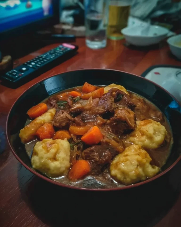 Delicious beef stew with fluffy dumplings served in a bowl