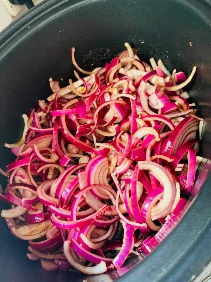 Red Onion and Chilli Jam in a jar with fresh chilies and onions