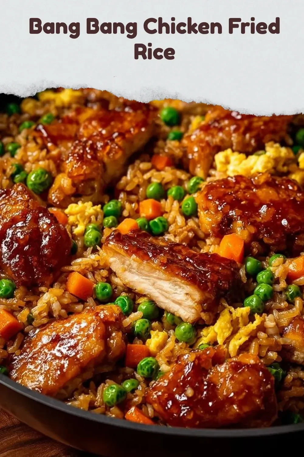 Plate of Bang Bang Chicken Fried Rice with colorful vegetables and toppings