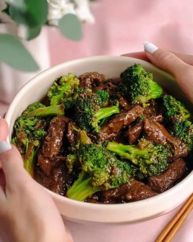 Delicious Beef and Broccoli Stir-Fry served in a bowl with chopsticks