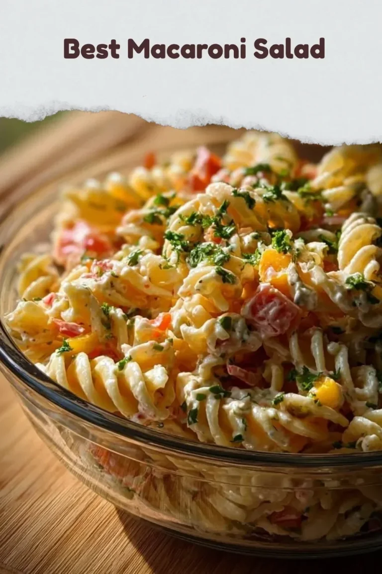 Delicious homemade macaroni salad served in a bowl with colorful vegetables