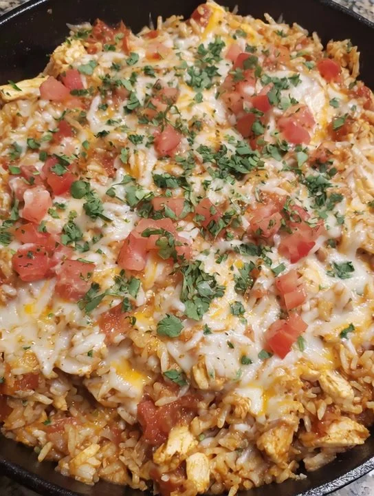 Delicious Cheesy Chicken Taco Rice served in a bowl with toppings.
