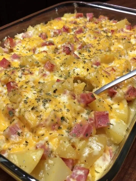 Cheesy ham potato casserole dish topped with crispy breadcrumbs and cheese