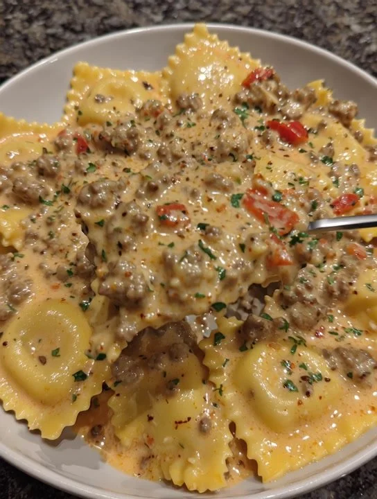 Creamy Cajun sausage ravioli served with a savory sauce