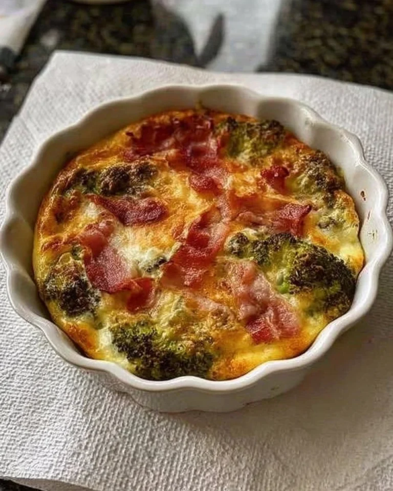 Air fryer crustless quiche served on a plate with fresh herbs
