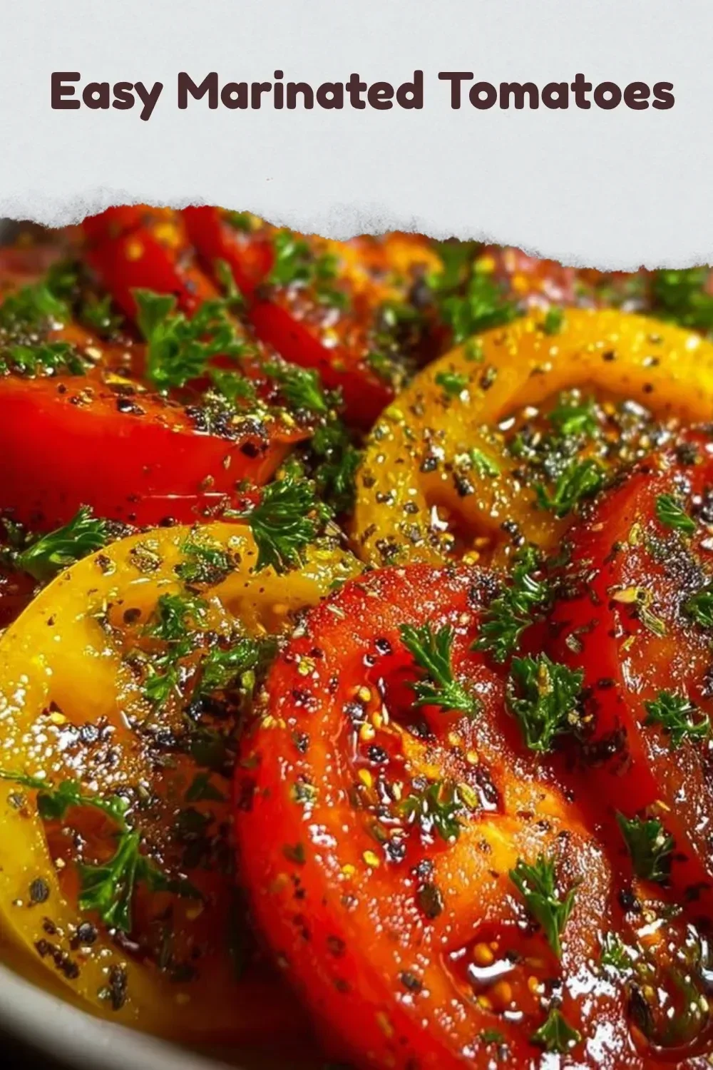 Bowl of easy marinated tomatoes garnished with herbs