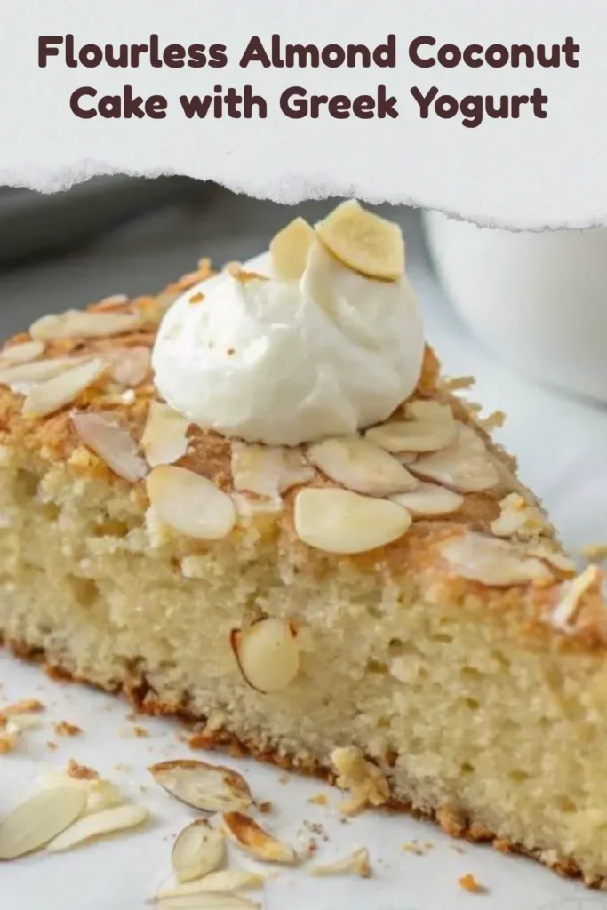 Flourless Almond Coconut Cake topped with Greek Yogurt and coconut flakes