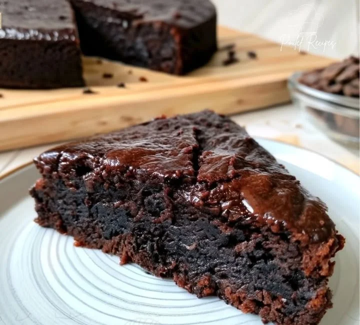 Flourless Black Cocoa and Chia Greek Yogurt Cake slice on a plate
