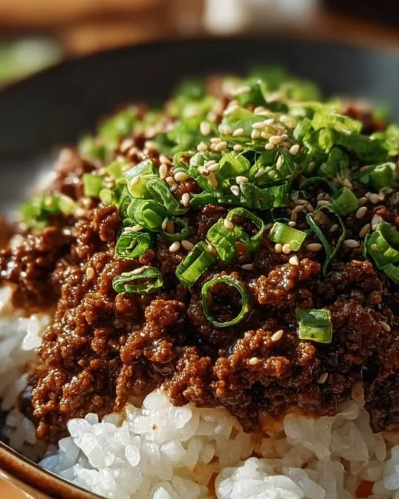 Korean Ground Beef Bowl topped with vegetables and sesame seeds