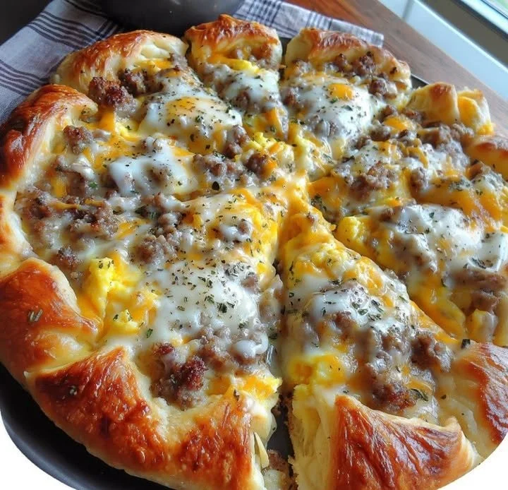Sausage gravy pizza topped with fresh ingredients and cheese