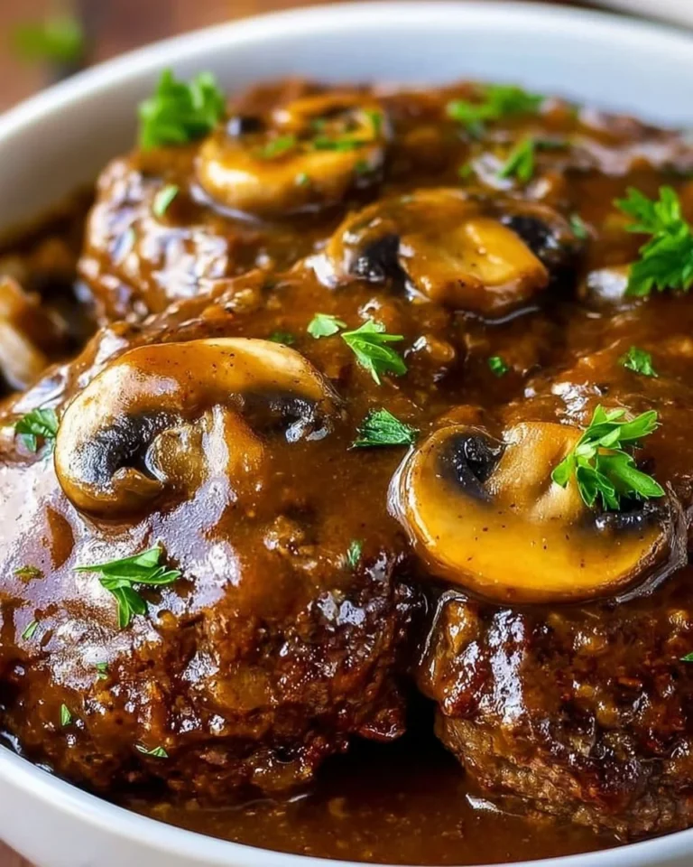 Delicious slow cooker Salisbury steak served with mashed potatoes