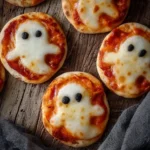 Spooktacular Mini Ghost Pizzas That Are Eerily Easy to Make Spooktacular Mini Ghost Pizzas That Are Eerily Easy to Make