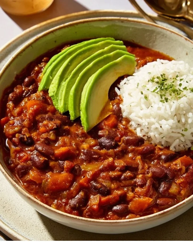 Bowl of hearty vegan chili filled with beans, vegetables, and spices