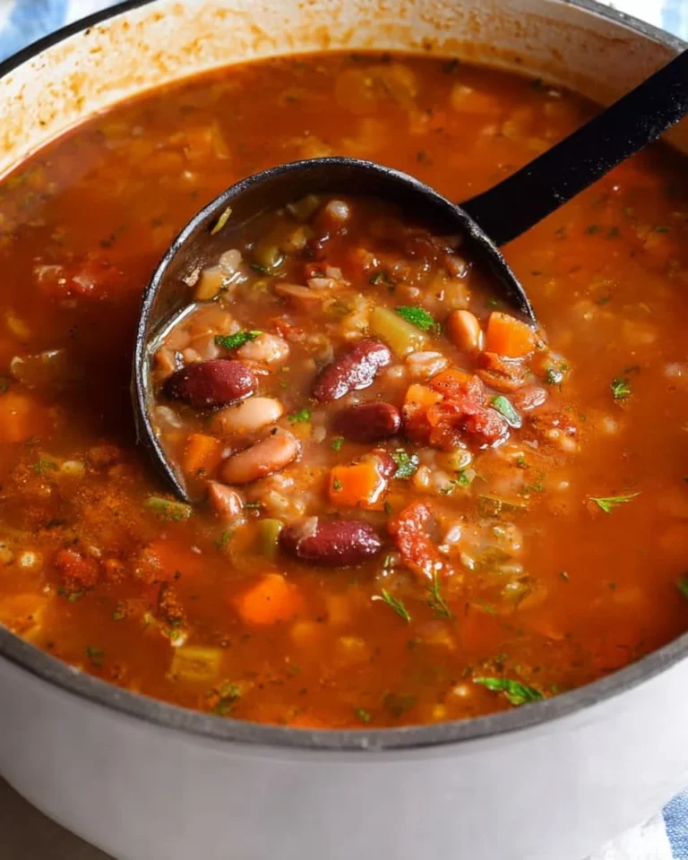 Bowl of 15 Bean Soup garnished with herbs and spices.