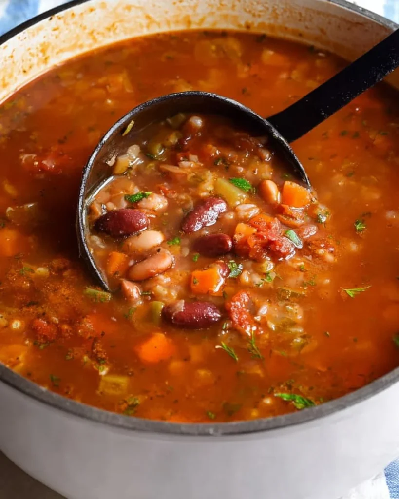 Bowl of 15 Bean Soup garnished with herbs and spices.