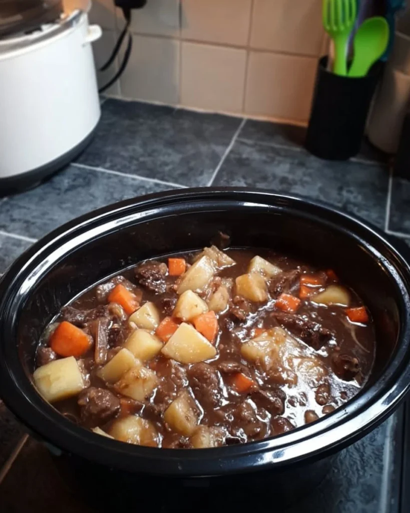 Delicious beef stew simmering with vegetables in a pot.