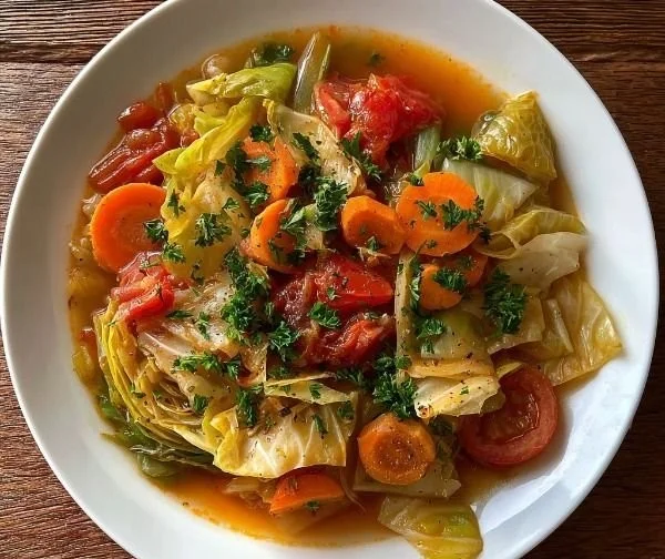 Bowl of Cabbage Fat-burning Soup with fresh ingredients.