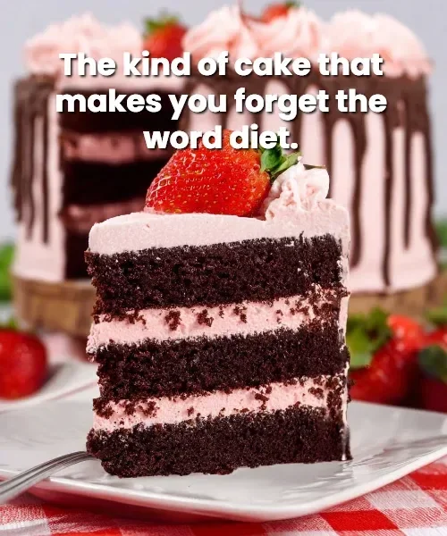 Chocolate Kahlua Cake topped with strawberry buttercream frosting on a white plate.