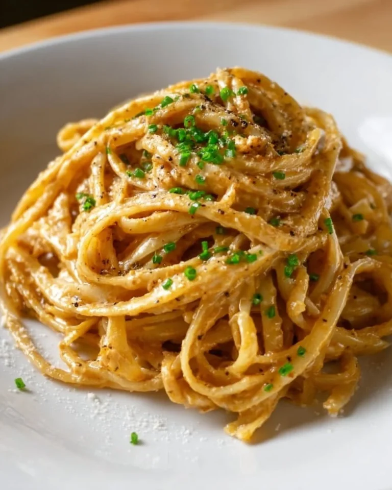 Creamy Cajun linguine served with spices and herbs, garnished with parsley.
