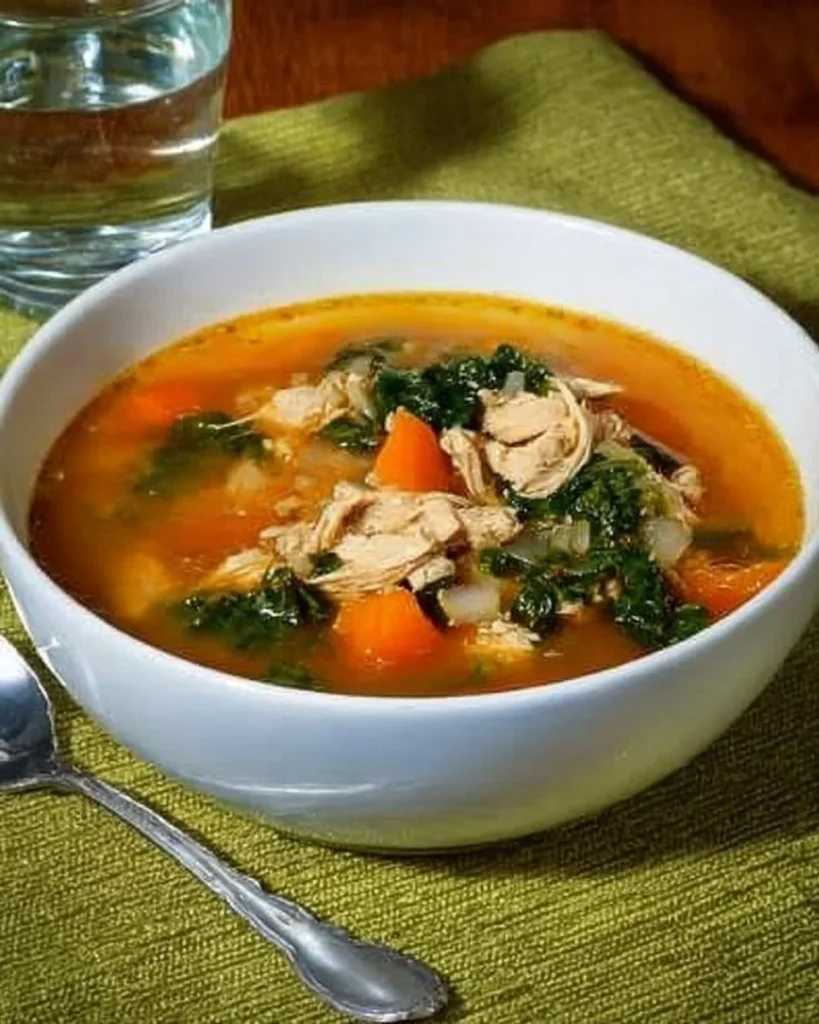 Bowl of hearty chicken vegetable soup with fresh ingredients