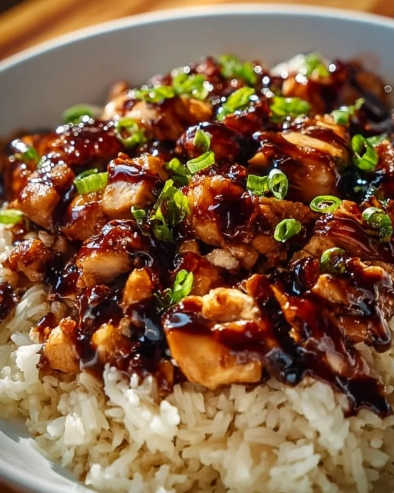 Plate of Honey BBQ Chicken served over rice with a side of vegetables