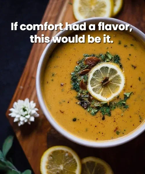 A bowl of Mediterranean butternut squash soup garnished with herbs and olive oil.