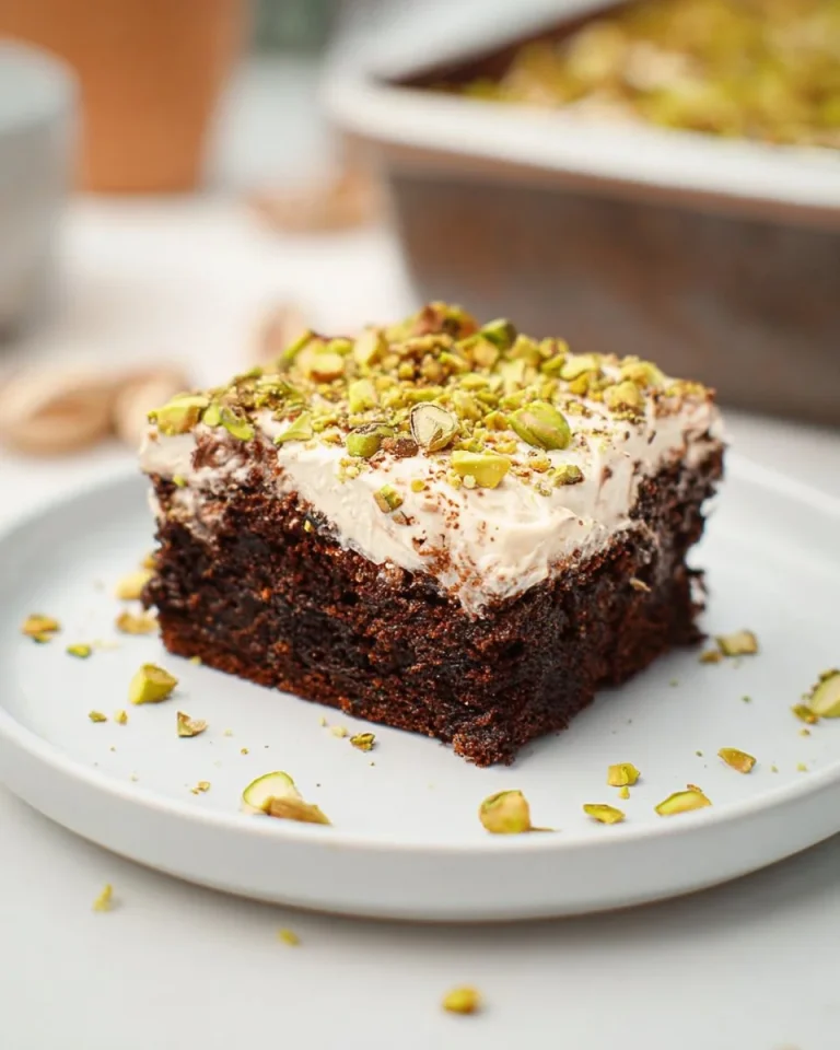 Delicious Baileys Irish Cream Cake topped with chocolate and cream