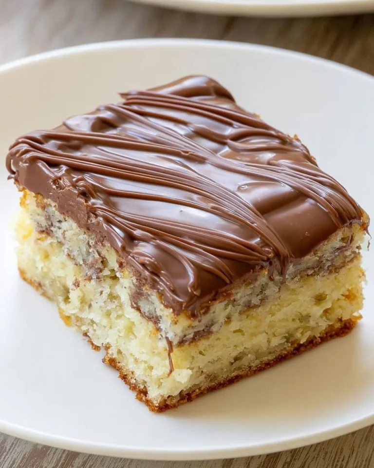 Delicious banana bread cheesecake bars topped with cream and nuts