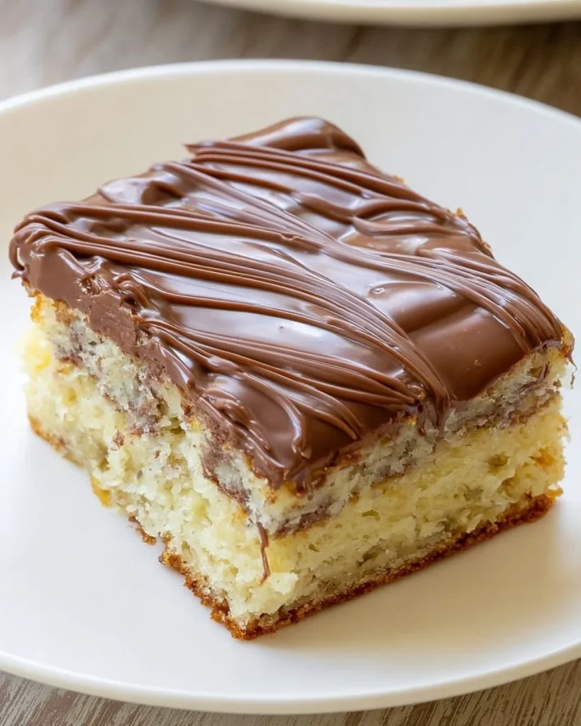 Delicious banana bread cheesecake bars topped with cream and nuts