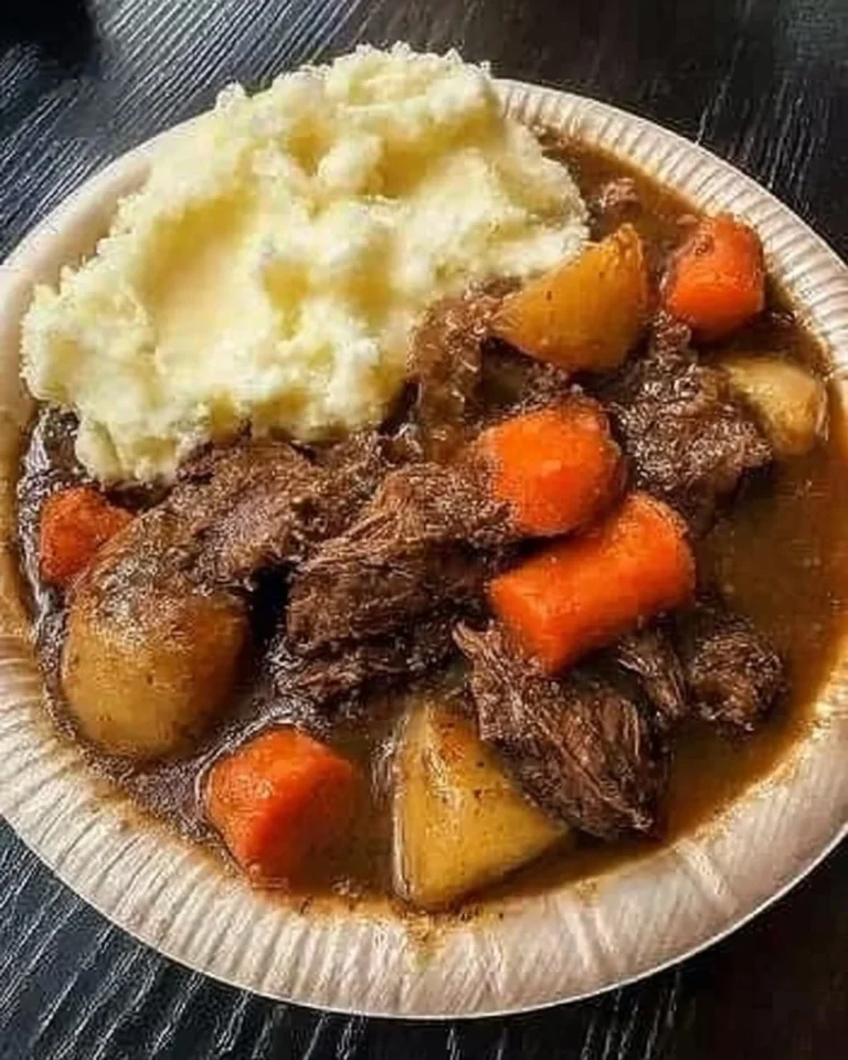 Savory Beef Pot Roast with potatoes and carrots in a flavorful sauce.