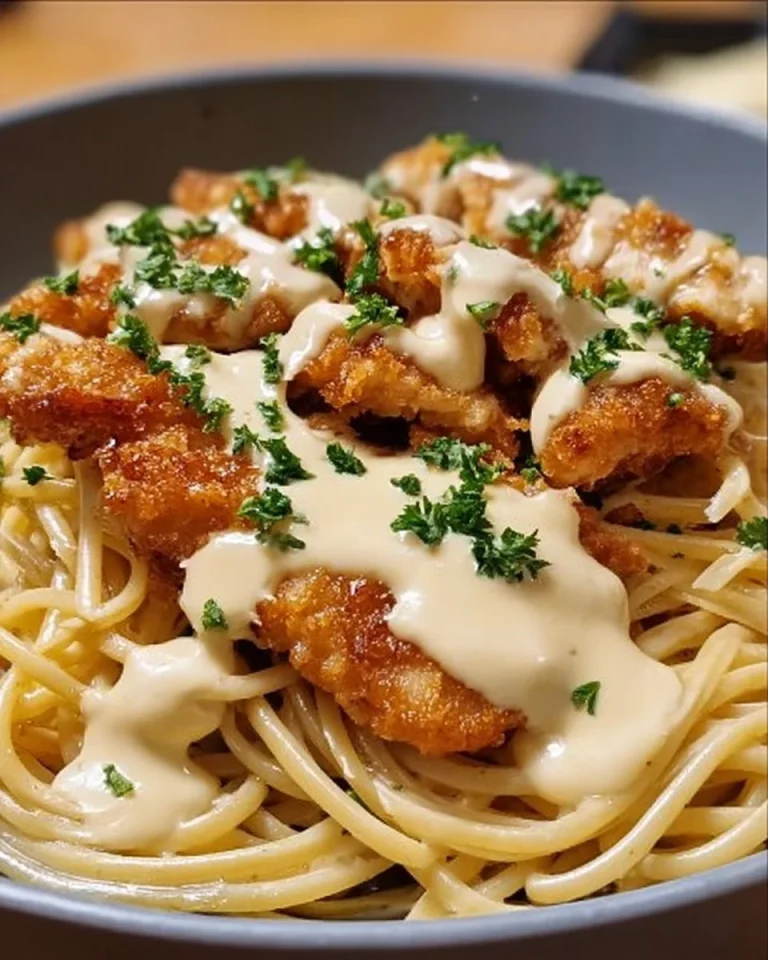 Cheesy chicken bites served with spaghetti in garlic parmesan sauce