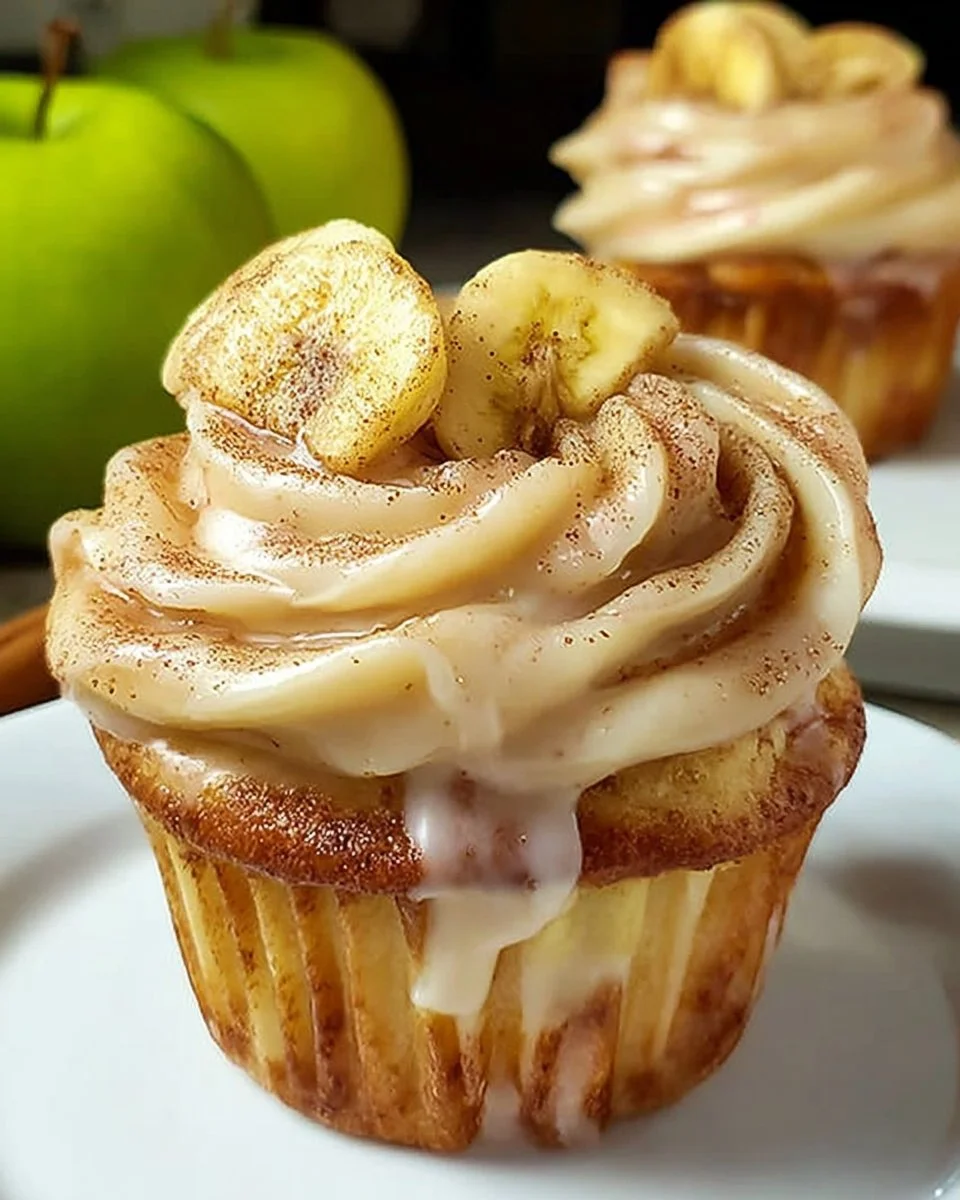 Delicious Cinnamon Apple Cupcakes made with crescent rolls, topped with frosting.