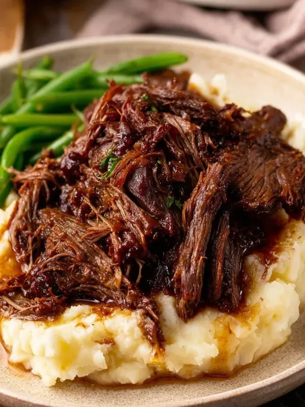 Cranberry pot roast served with vegetables on a plate
