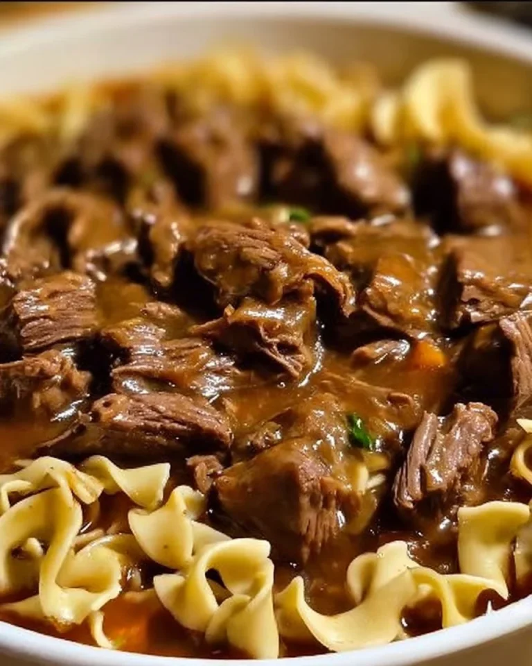 Crockpot Beef Tips served with noodles in a hearty sauce