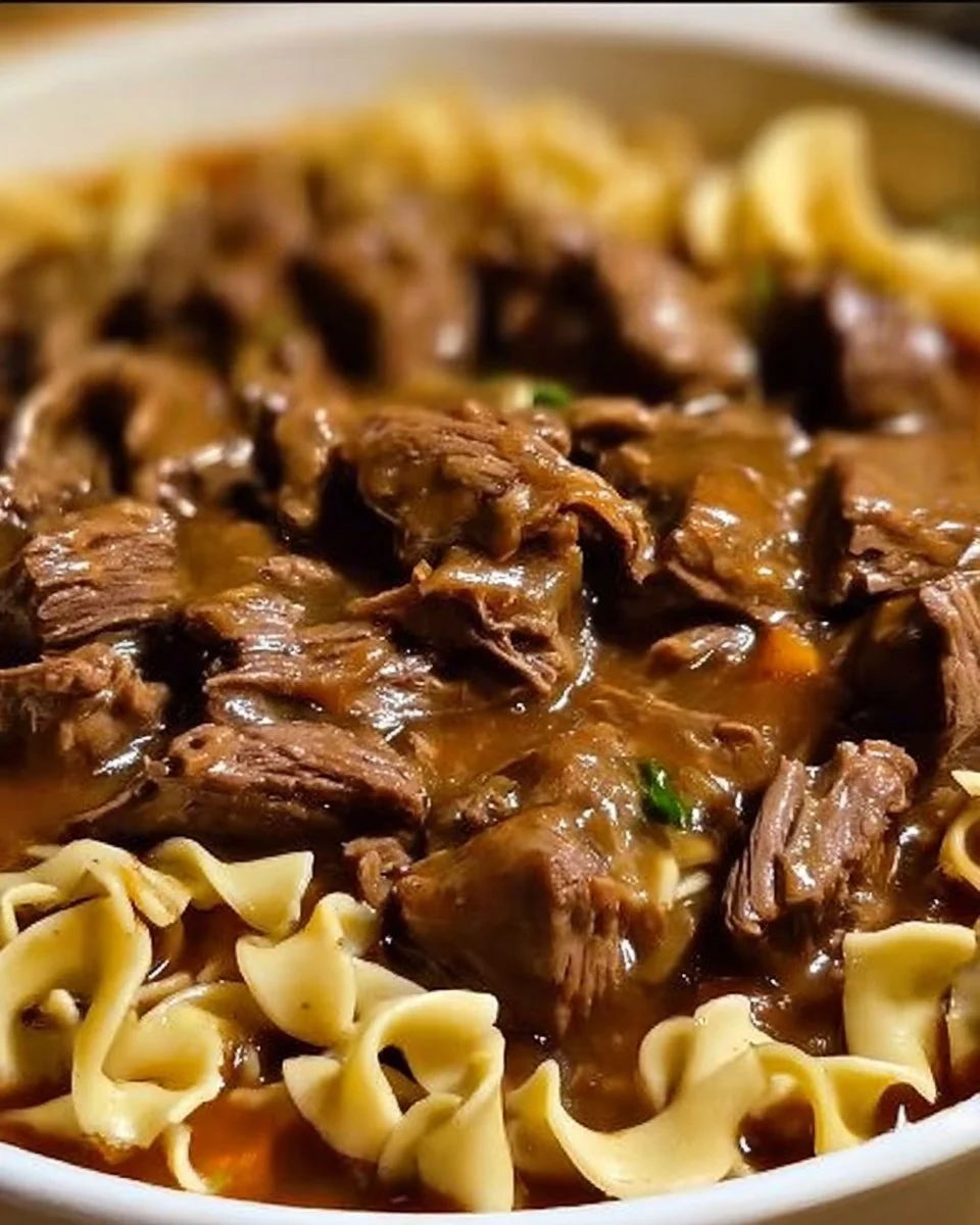 Crockpot Beef Tips served with noodles in a hearty sauce
