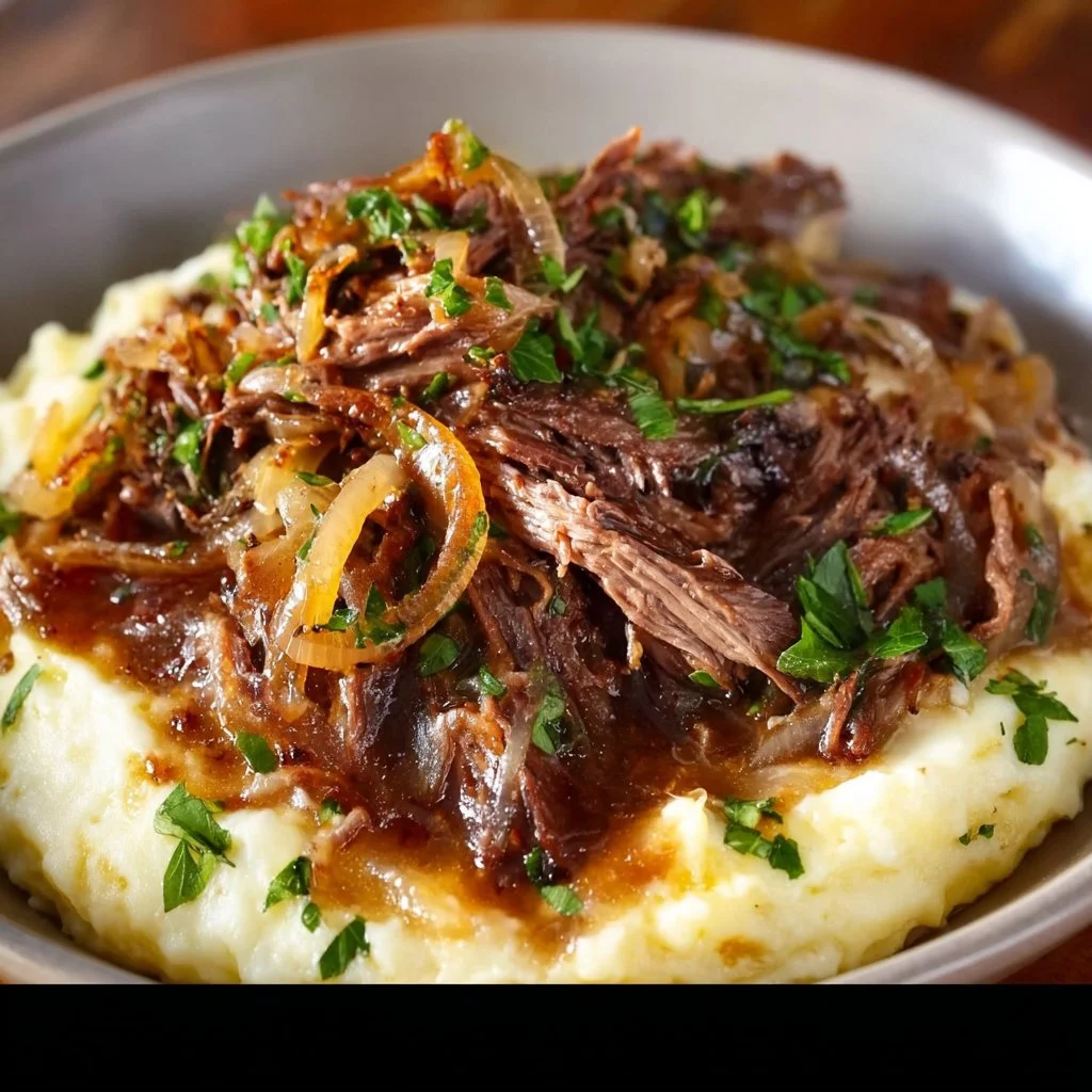 Delicious French Onion Pot Roast served with melted cheese and herbs