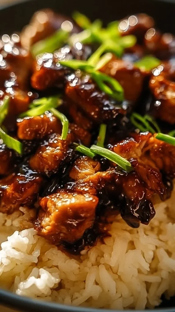 Honey BBQ Chicken served on rice with fresh garnish