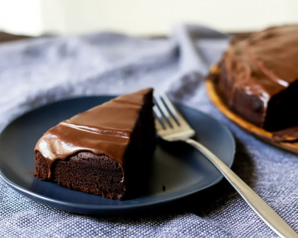 Delicious Chocolate Olive Oil Cake topped with chocolate fudge glaze