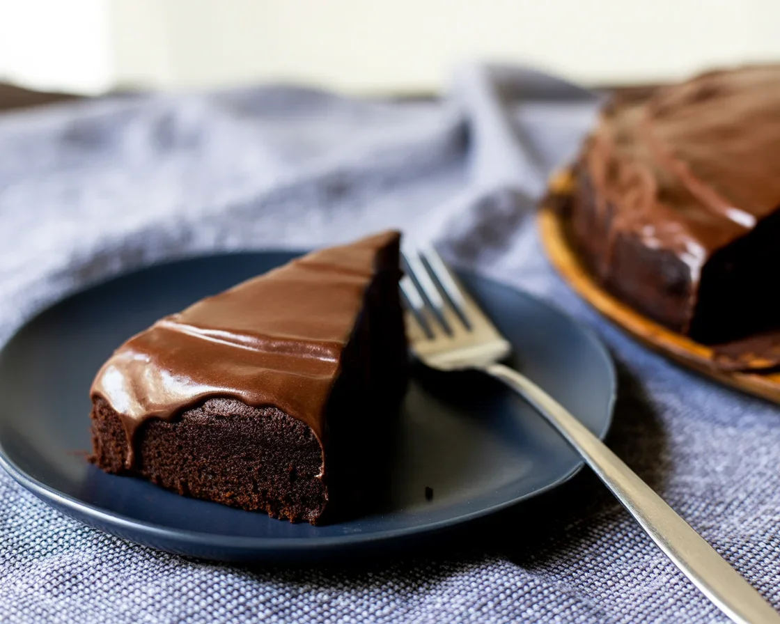 Delicious Chocolate Olive Oil Cake topped with chocolate fudge glaze