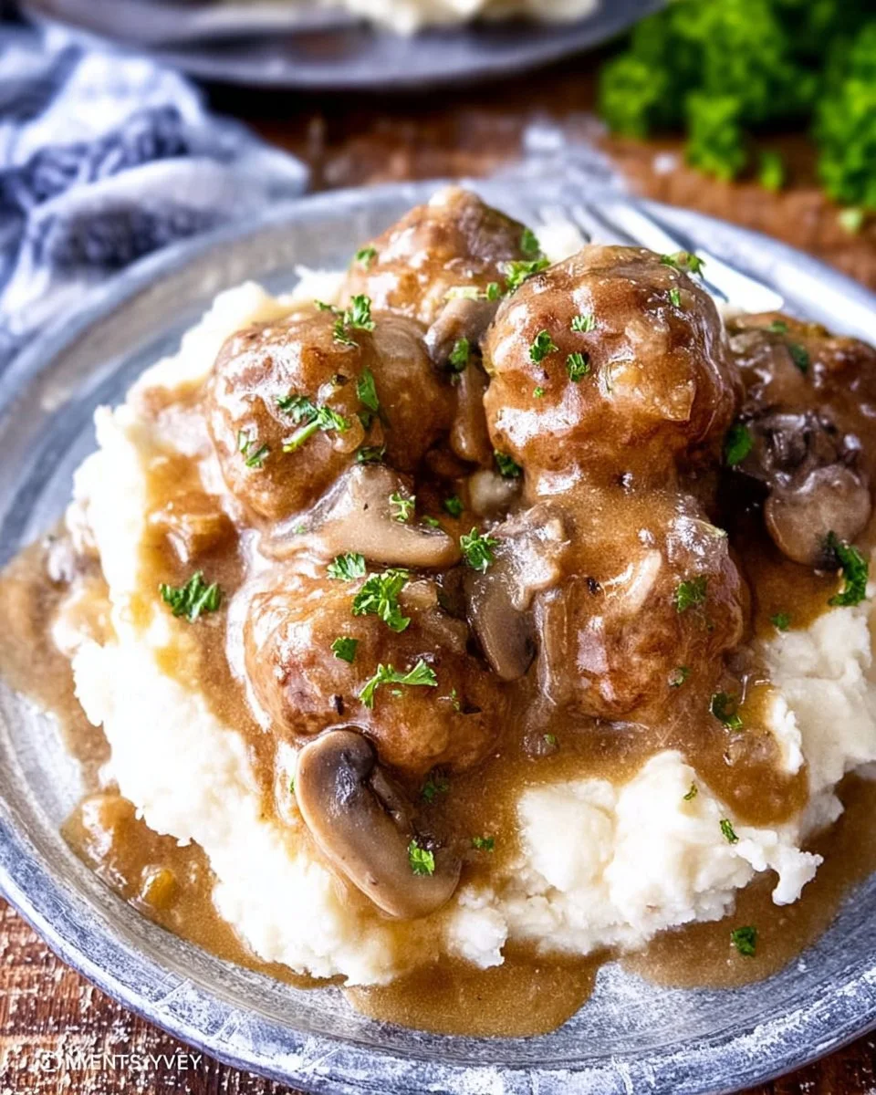Delicious meatballs served with savory gravy on a plate.