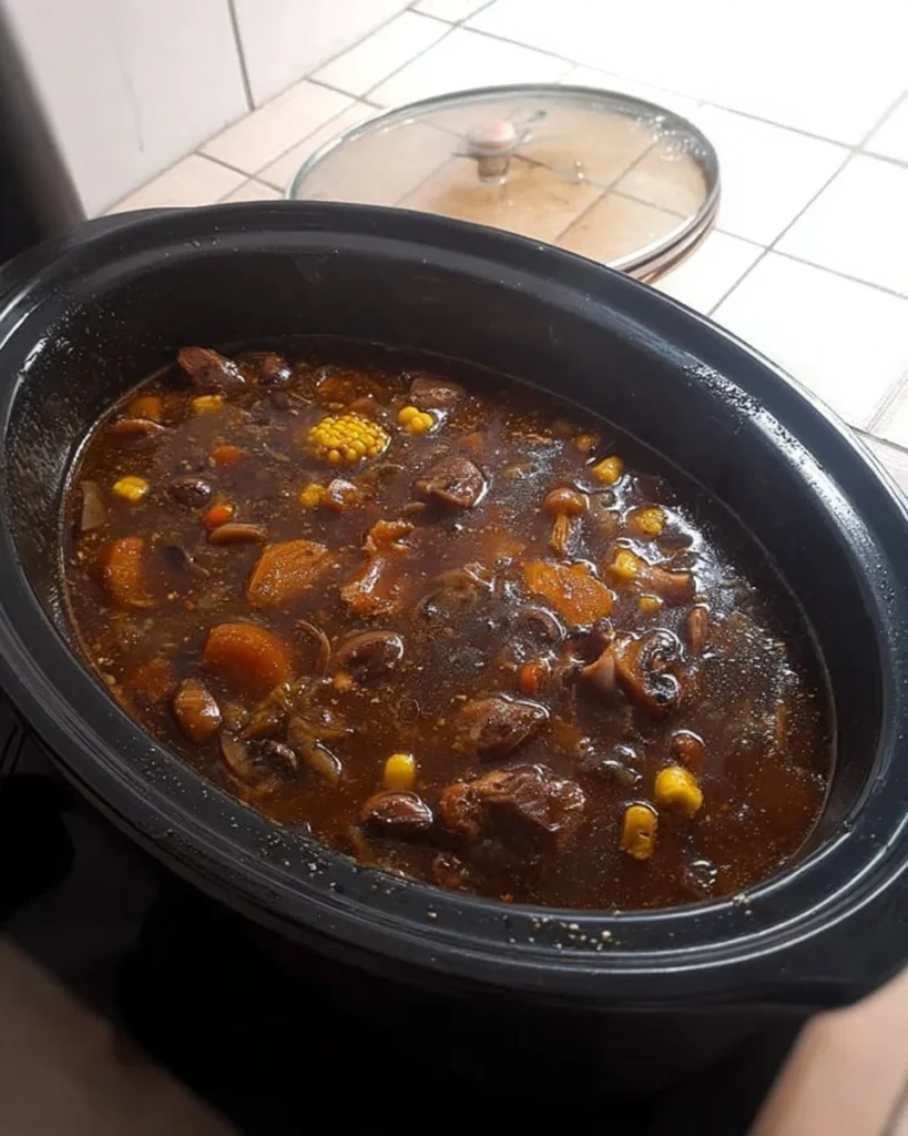 Bowl of minted lamb stew with fresh herbs and vegetables