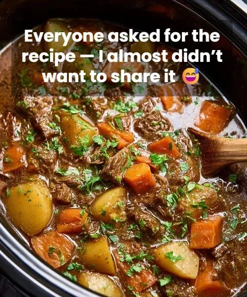 Delicious slow cooker beef stew with vegetables and herbs in a bowl