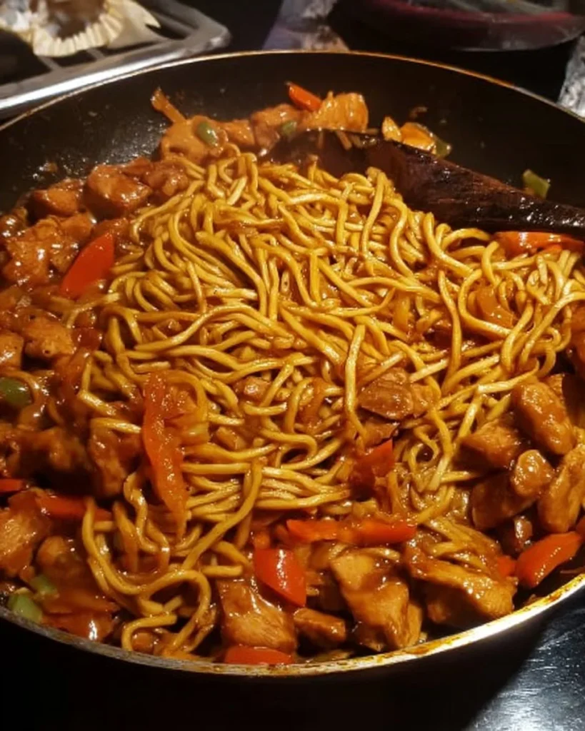 Delicious sticky chicken served with noodles in a flavorful sauce