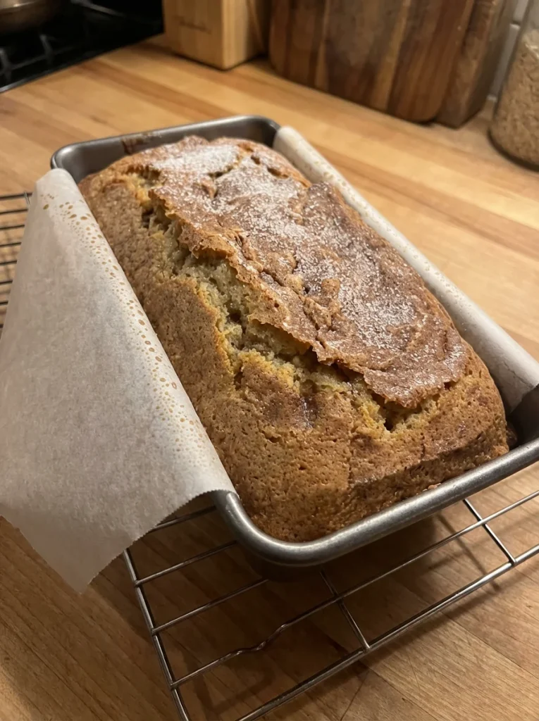 Freshly baked Amish Cinnamon Bread with a swirl of cinnamon and sugar