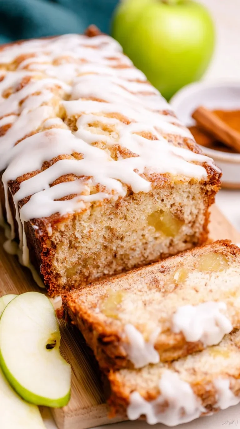 Freshly baked apple bread with slices ready to serve.