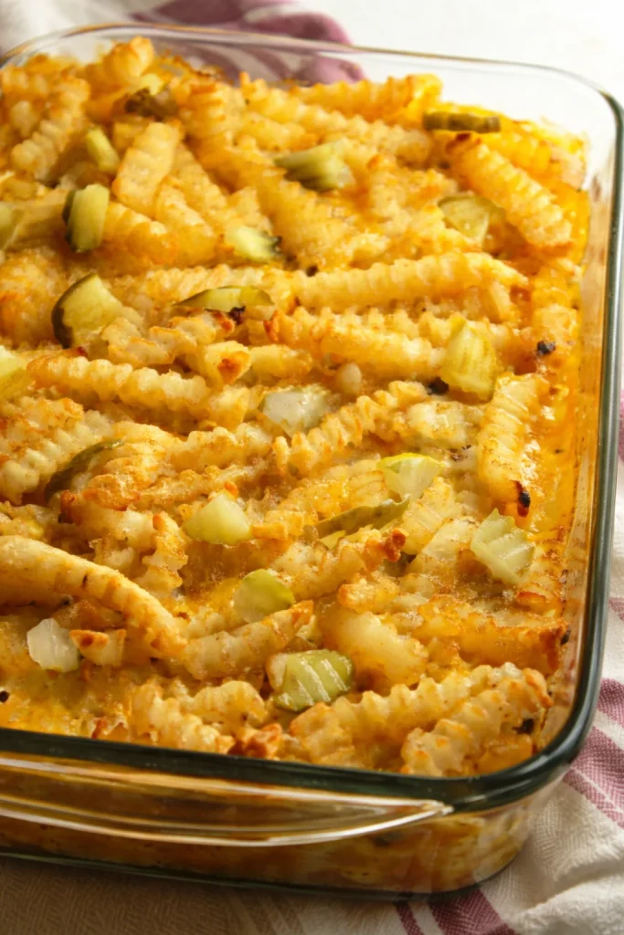 Cheeseburger French Fry Casserole topped with crispy fries in a baking dish